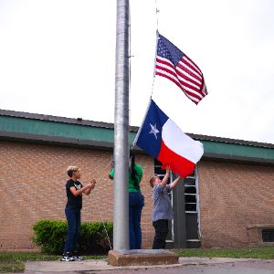  Students raising the flag.